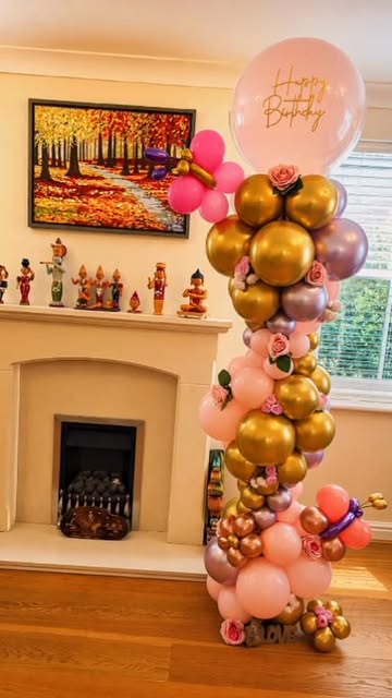 Gold and pink chrome balloon column with Happy Birthday balloon
