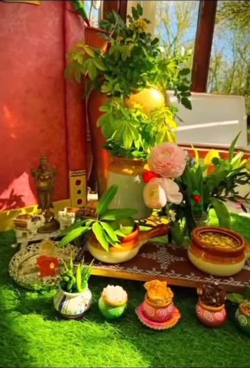 Traditional pooja table styling with flowers and pots